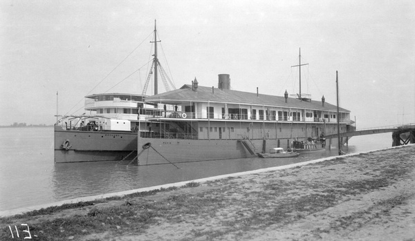 A steamship moored by China Navigation Company hulk 'Pekin' in Wuhu