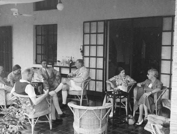 Drinks on the veranda, No. 3 Shek O, Hong Kong, 1940, including C.C. Roberts