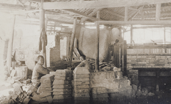 Workers at a crude furnace, New Wah Chang Co., Hsi Kwan Shan (Xi guan shan?), Hong Kong