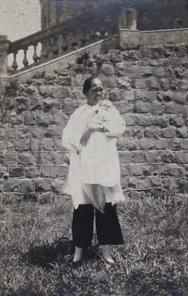 An amah holding David Arthur George Trobridge as a baby, Hong Kong