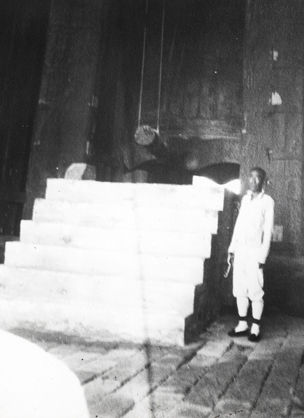 A man beside the Great Bell, in the Bell Tower (Zhonglou 钟楼), Beijing