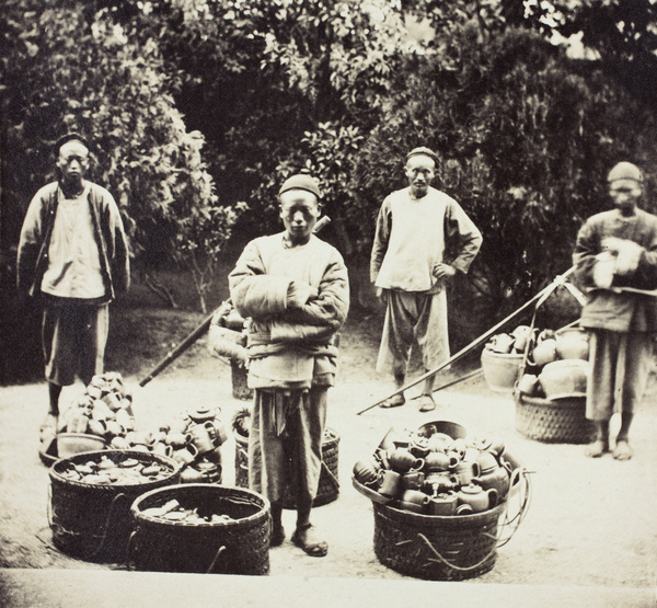 Teapot and crockery vendors, posed in a garden, Shanghai