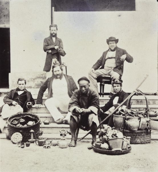 A group posed with a teapot seller, Shanghai