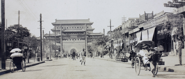 The arrow tower of Chongwenmen (崇文門 Hatamen), with street and pailou