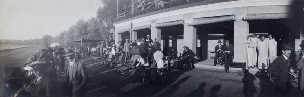 Spectators beside grandstand at Peking racecourse (Pao Ma Chang)