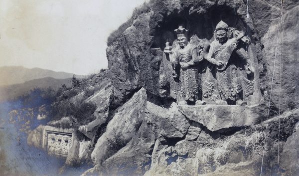 Carvings in rocks - a figure with a stringed instrument