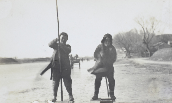 Two boys on wooden sledges (paitse)