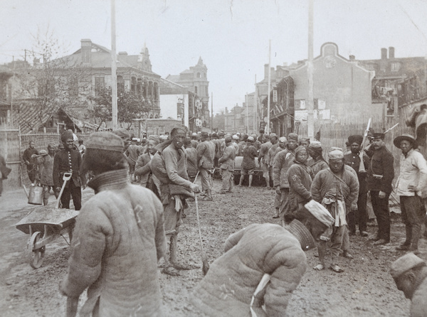 Convicts (chain gang) from the Municipal Gaol making a road, Shanghai