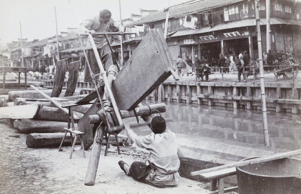 Sawing planks beside a creek, Shanghai