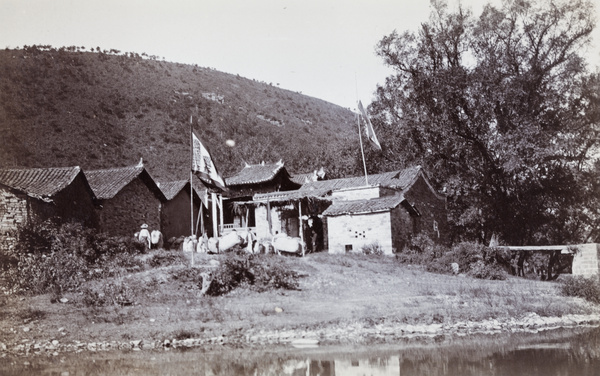 Chinese official's house, with flags