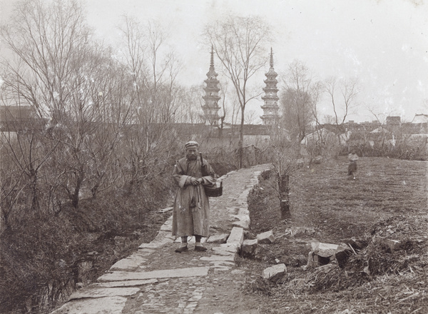 A man on a path near the Twin Pagodas at Luohanyuan Temple, Soochow (苏州双塔)
