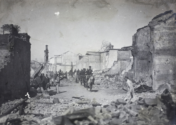Revolutionary soldiers going through ruins of Wuchang