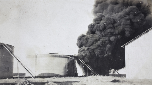 Standard Oil Company holding tank set on fire by a Qing navy shell