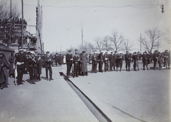 British Bluejackets (marines) and volunteers guarding the main exit from the Chinese City during the Hankow Riots, Wuhan, January 1911