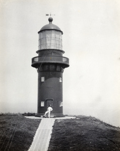 Man by door to Shaweishan Light, Tsungming Island