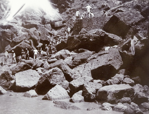 Workers moving and stacking bricks