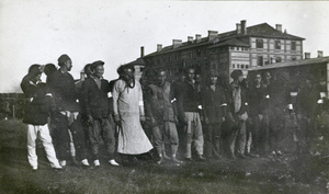 Line up of men with white armbands