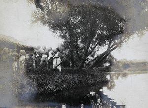 People by the riverbank