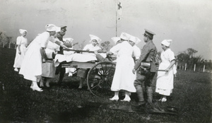 Army nurses with a 'hand litter' stretcher