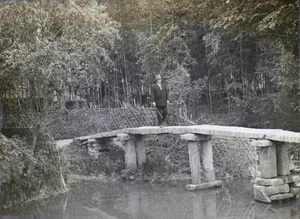 A European on a stone bridge