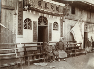 Couple with a child outside decorated building