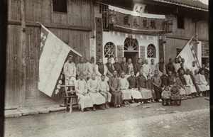 Large group outside a decorated building