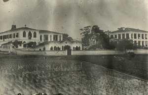 Large Christian building, house and fields