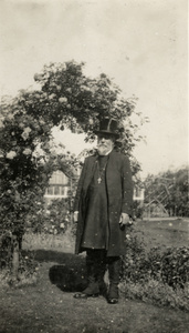 Bishop Banister and an arch of roses