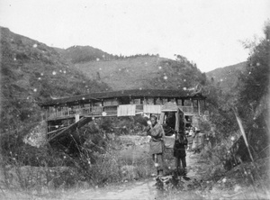 Covered bridge, sedan chair and peddlars