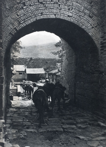 Camel train passing through a gateway at Juyongguan, near Beijing