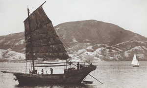 A fishing junk and a small recreational sailing boat, Hong Kong