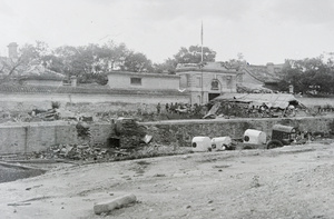 Sikh troops in front of the barricaded entrance to the British Legation, Peking