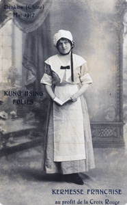 Studio portrait of a woman, relating to a fashion fundraising fair for the Red Cross, Hankou