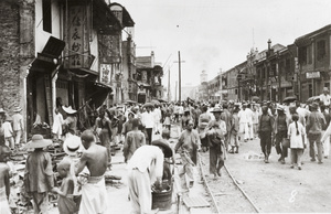 Busy damaged shopping street, Hankow