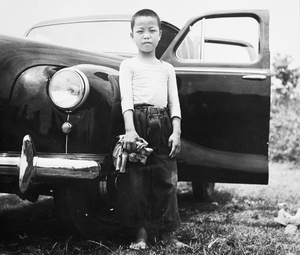 Child polishing a car, Hong Kong