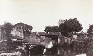 Two men by a canal bridge