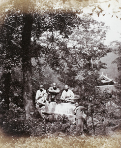 Stone tortoise and priests at Putuoshan (Mount Putuo)