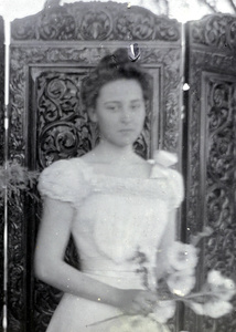 Maude Carrall holding flowers