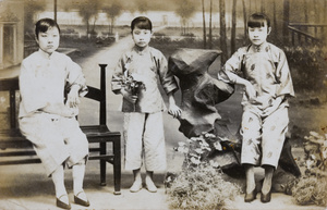 Young women in a ‘garden’ (in a photographer’s studio)