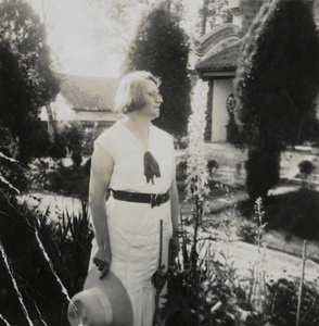 Marjorie Cottrell with tall delphiniums