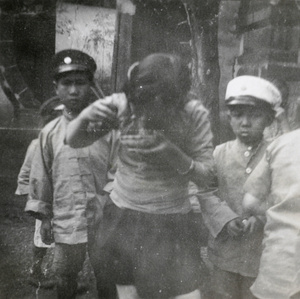 A schoolgirl eating, Methodist Mission School, Chaotung