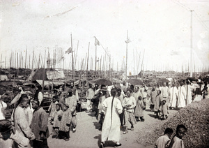 Pedestrians on the Chinese Bund, Shanghai, on a sunny day