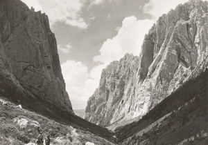 Valley in mountains, with mountain guides