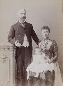 Studio portrait of D.M. Henderson and family