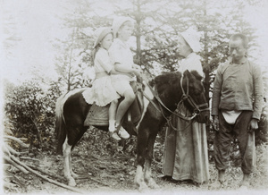 Zoe, Evans (Charles) and Mrs Elliott, with a groom and pony