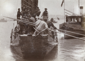 Evacuees in a boat pushing off from the Bund, Shanghai, 1927