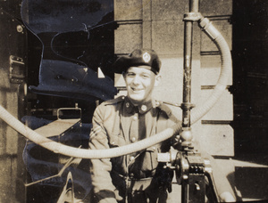 Eric Davies refuelling an armoured car, Shanghai, 1932