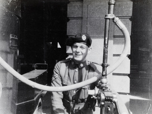 Eric Davies refuelling an armoured car, Shanghai, 1932