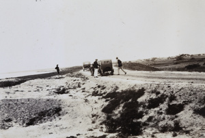 Two cars parked on a road