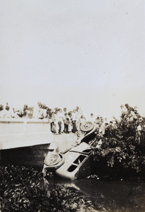 Onlookers by a car crash